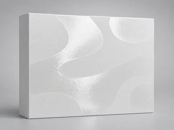 Macro illustration: a gloss spot-UV pattern catching the light over a matt white board.